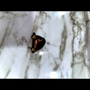 Black woman peeking Croc shoe charm 💛